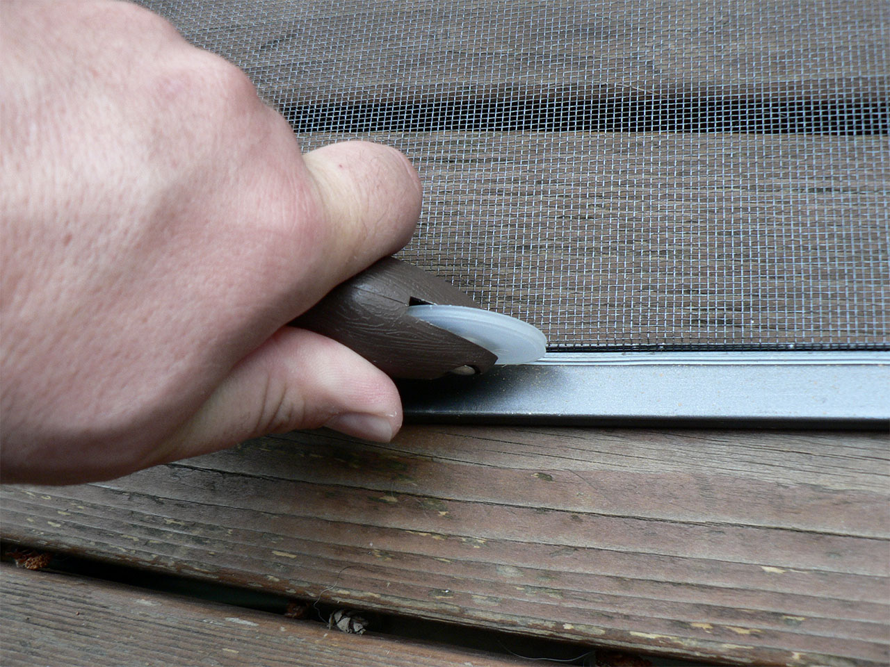 repairing a screen door