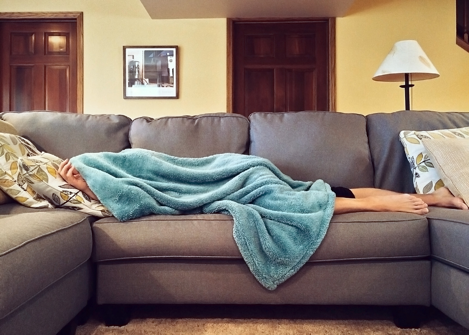 sick person hiding under a blanket