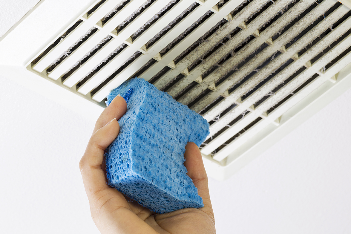 cleaning a dirty bathroom exhaust fan