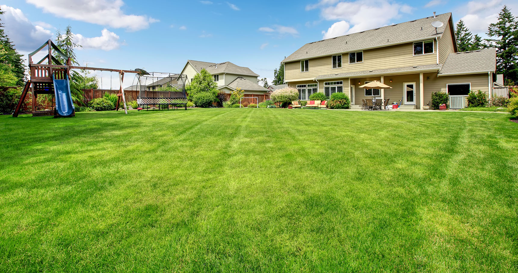 Large beautiful fenced backyard with play ground and nice house