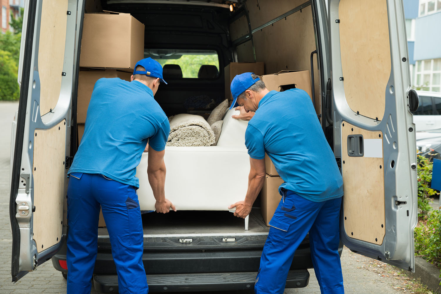 movers moving a white couch