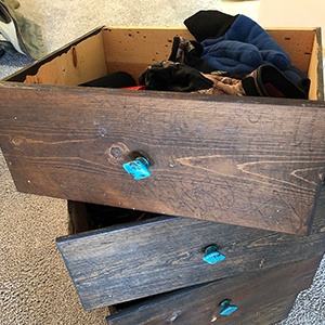 drawers removed from dresser stacked on top of each other