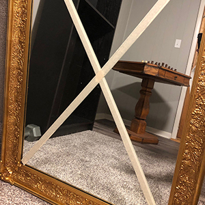 mirror with tape ready to move