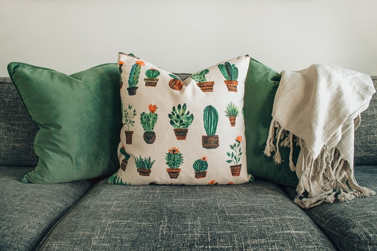 green throw pillows on a couch