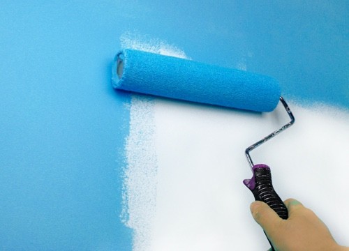 paint roller with teal paint
