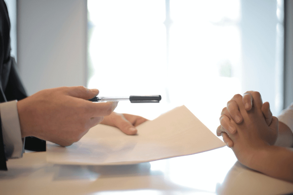 property manager handing over a lease agreement