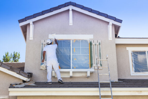 house painter painting windows and trim